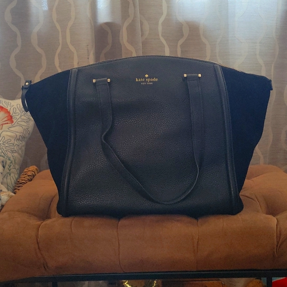 Black leather Kate Spade with suade sides.